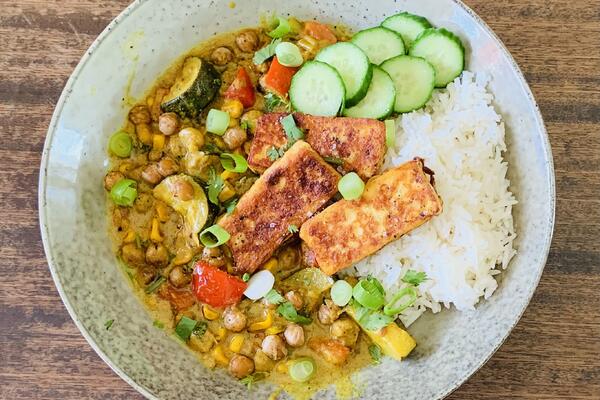 image of ​Summer coconut chickpea curry with rice and fried halloumi.    